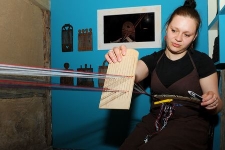 Weaver at the weaving loom in the Pomeranian Folk Culture Museum in Swołowo