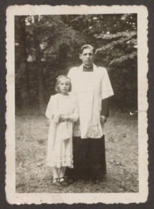 First Holy Communion of Maria Karwowska, next to Rev. Marian Patalas